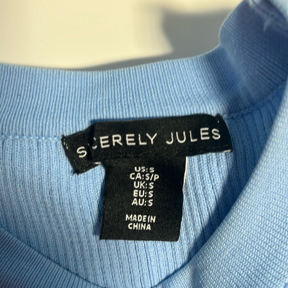 This is a Sincerely Jules long sleeved light blue top.